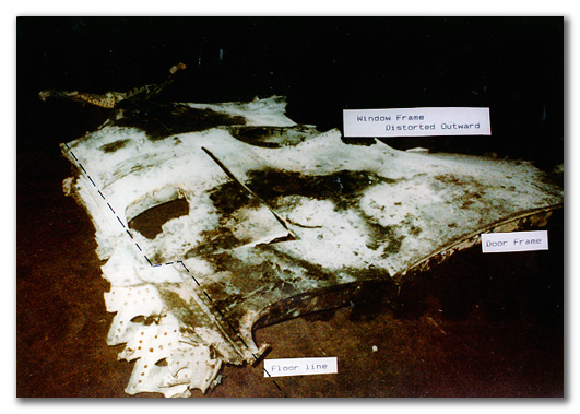 Figure DO10. Explosively punched hole in fuselage panel